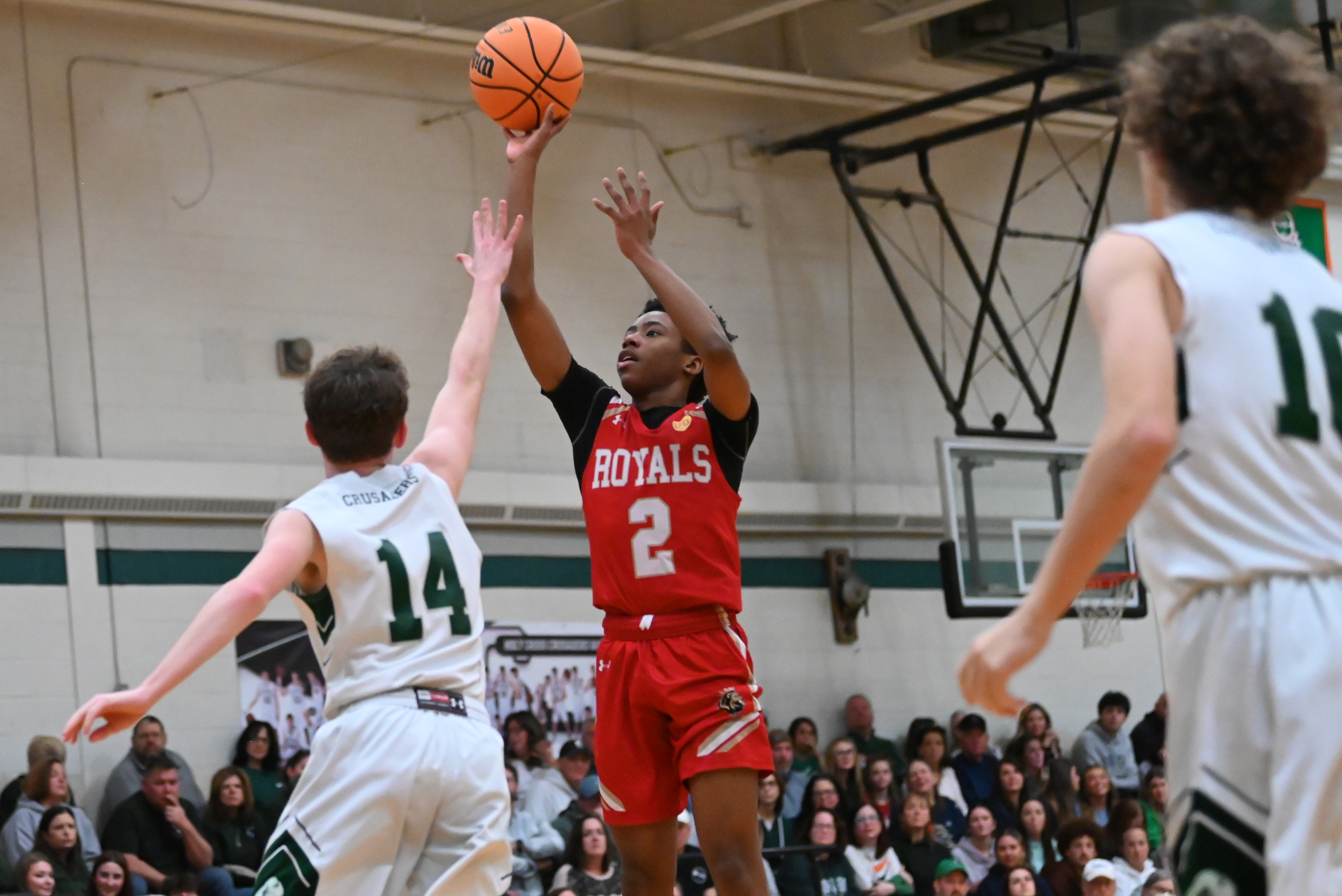 Holy Cross’ Colin Farrell reaches for Holy Redeemer’s Quron Drayton...