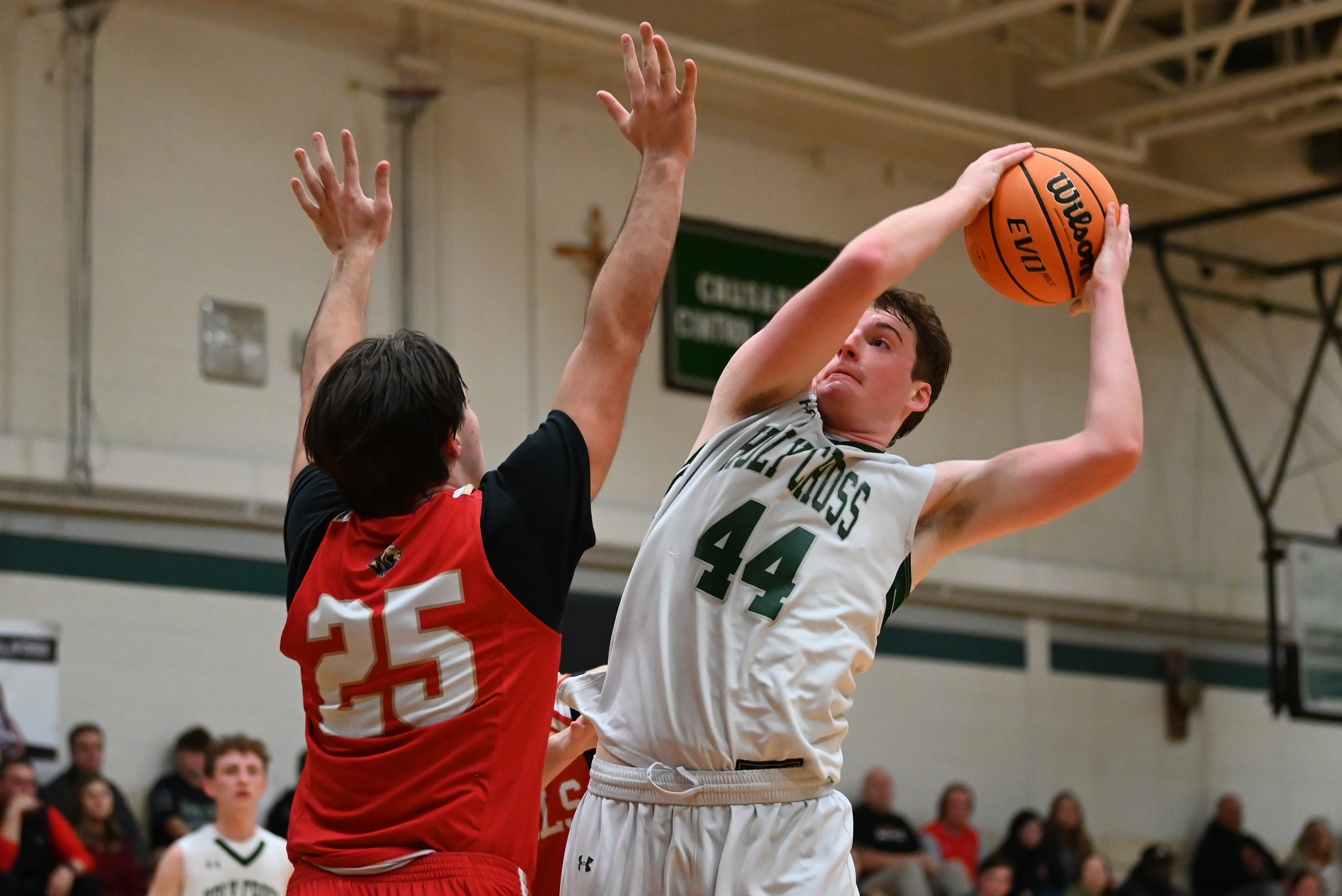Holy Redeemer’s Caden Sepkoski tries to block Holy Cross’ Colin...