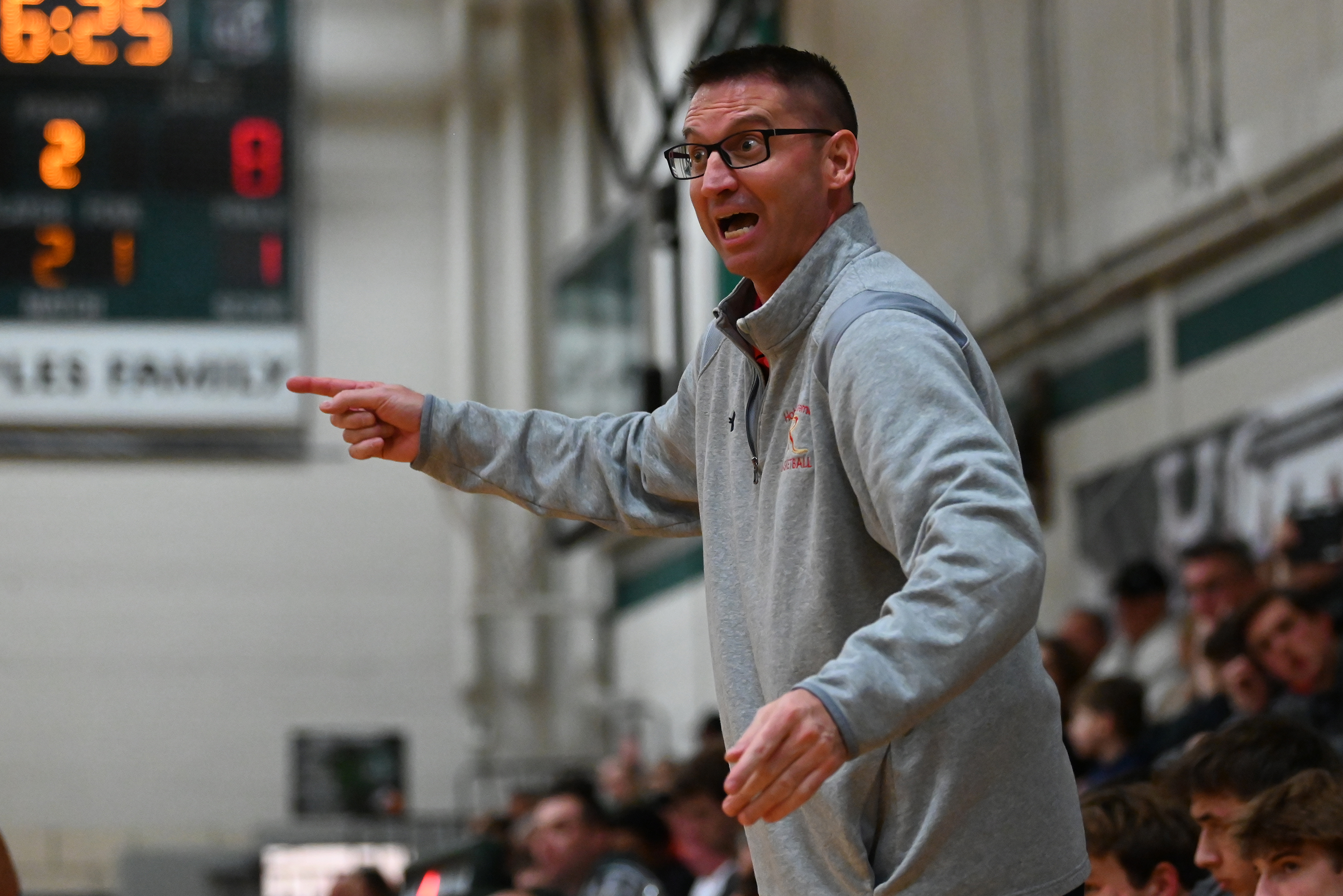 Holy Redeemer’s head coach Paul Guido calls out to players...