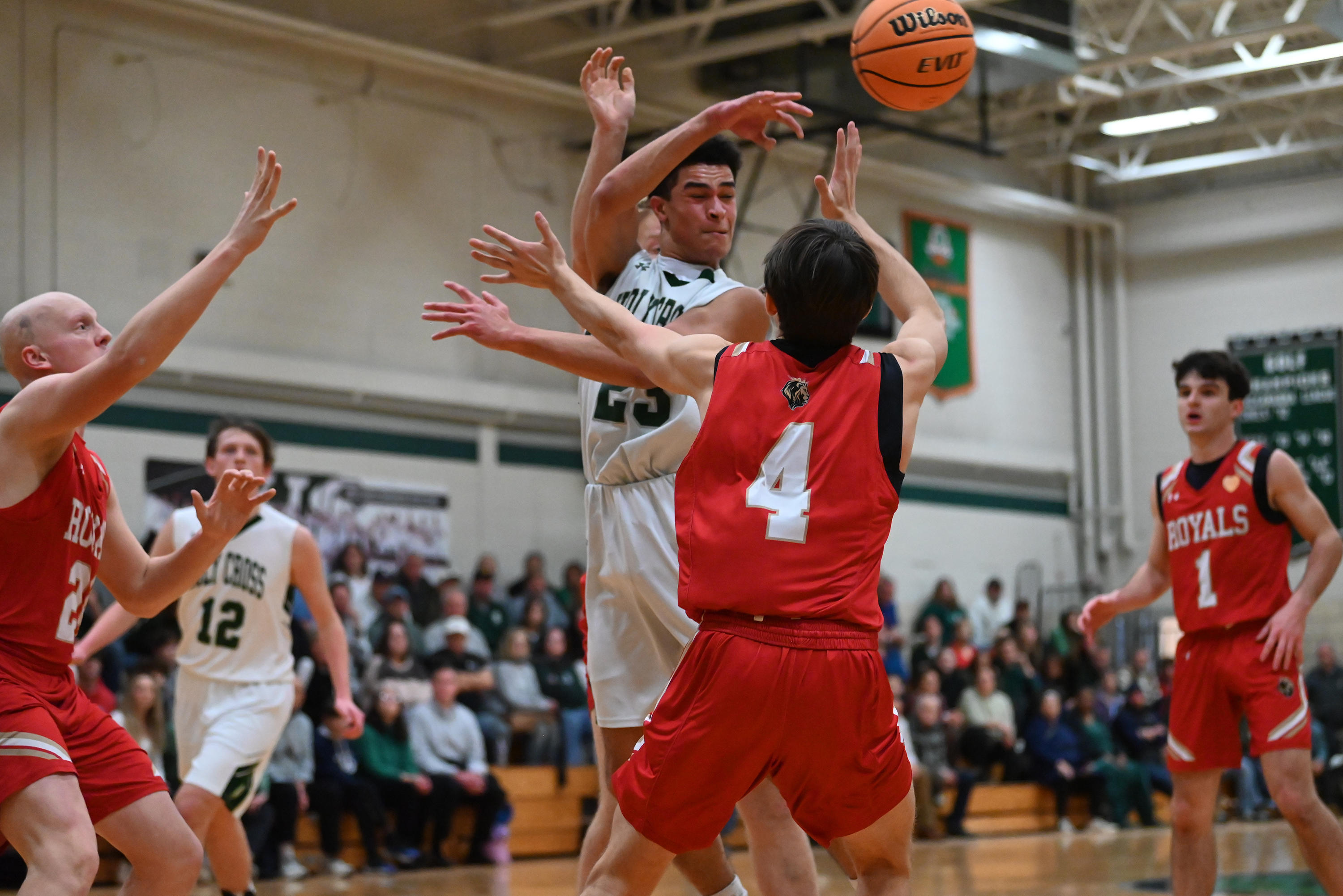 Holy Cross’ CJ Thompson attempts to make a pass during...