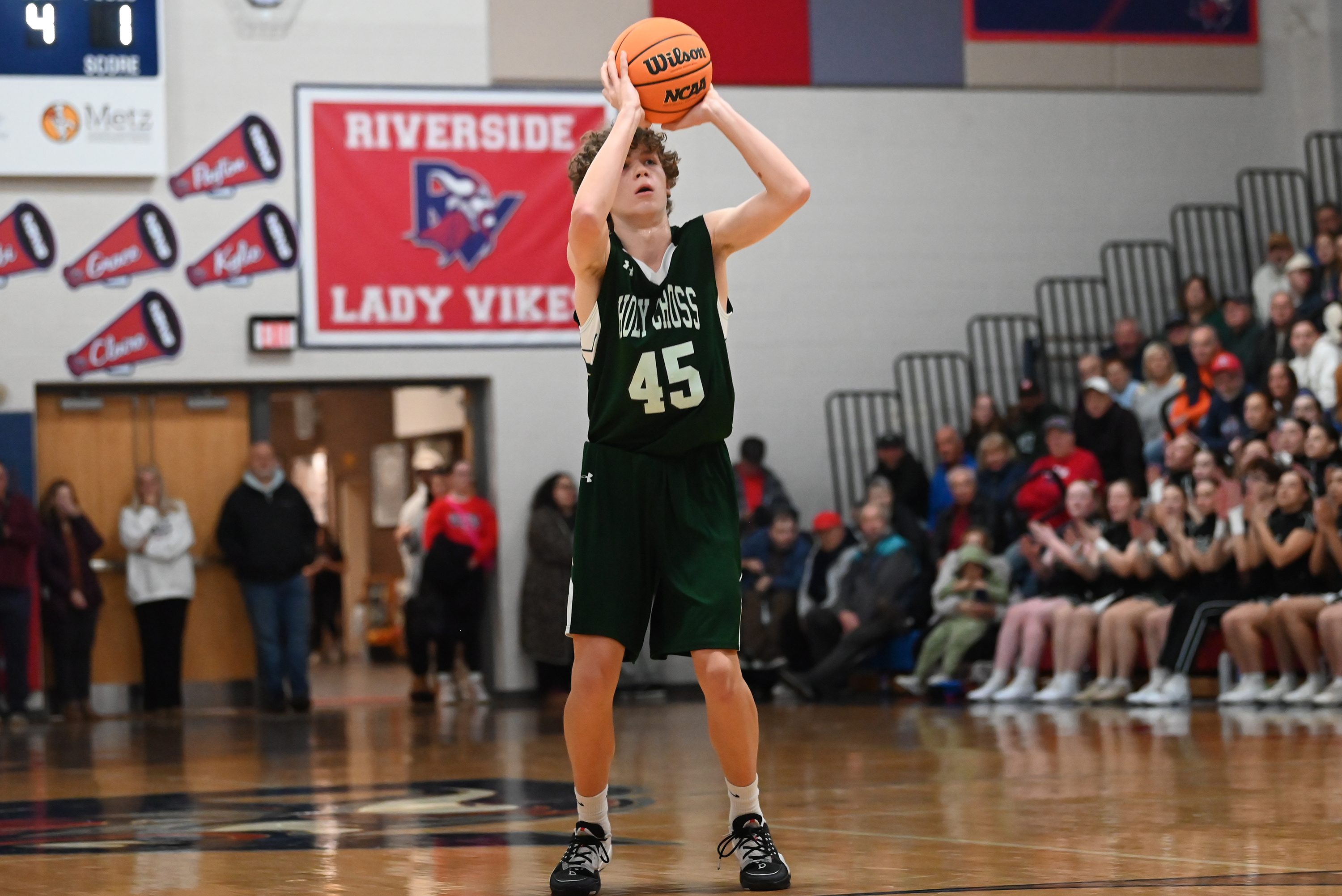 Holy Cross’ Thomas Gavin shoots during the basketball game at...