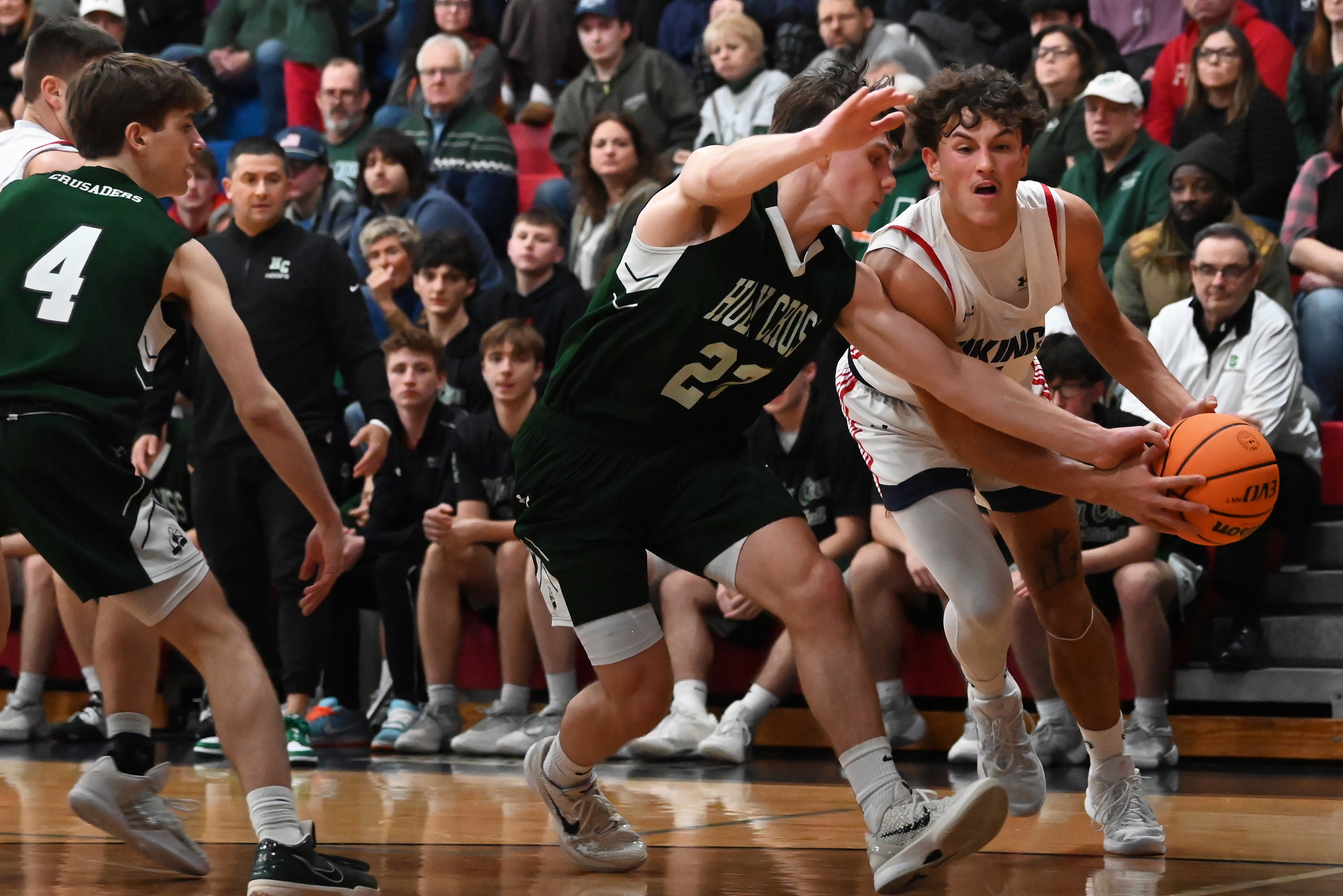 Holy Cross’ Jack Alpent battles Riverside’s Brayden Rose for control...
