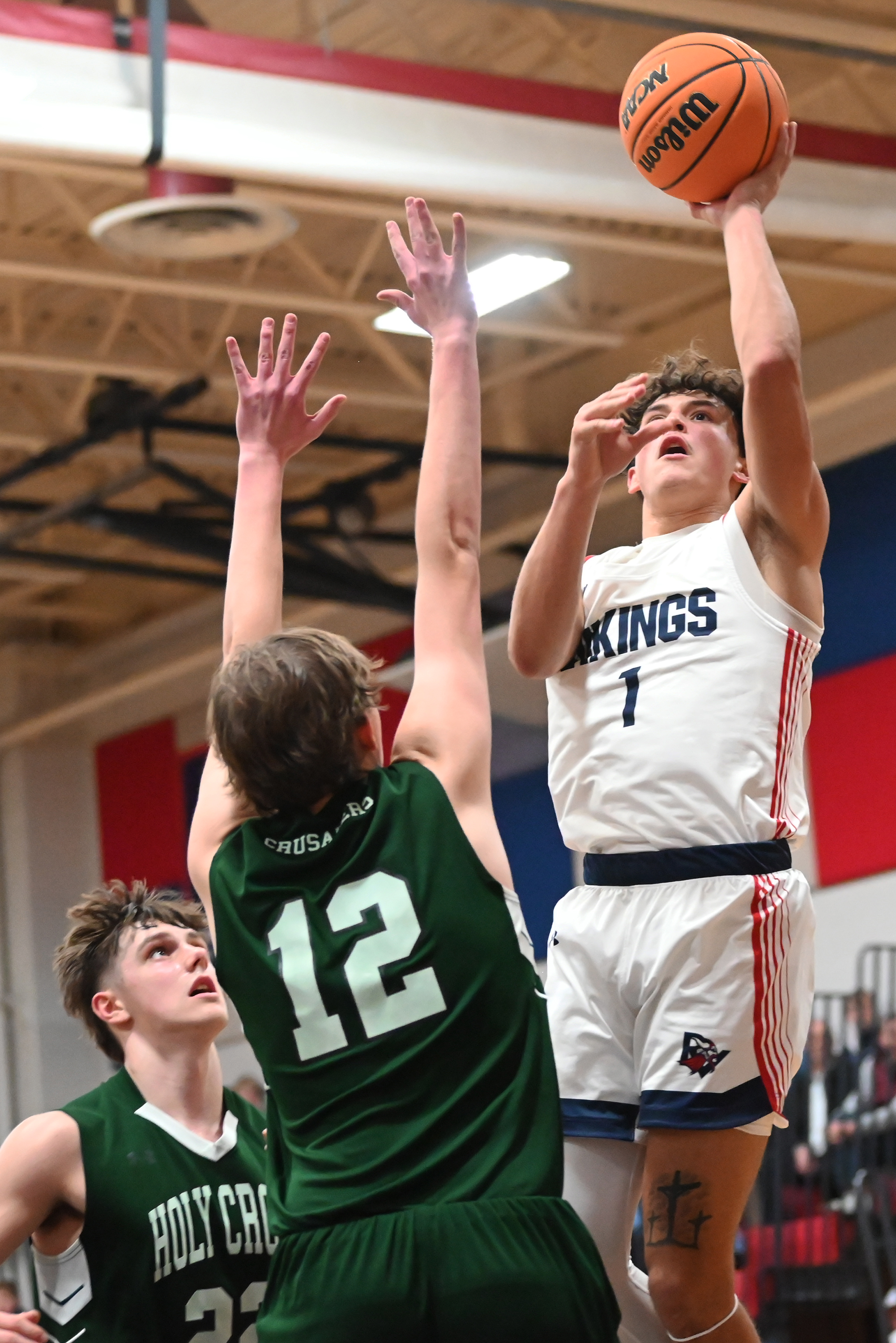 Riverside’s Brayden Rose goes up for a shot against Holy...