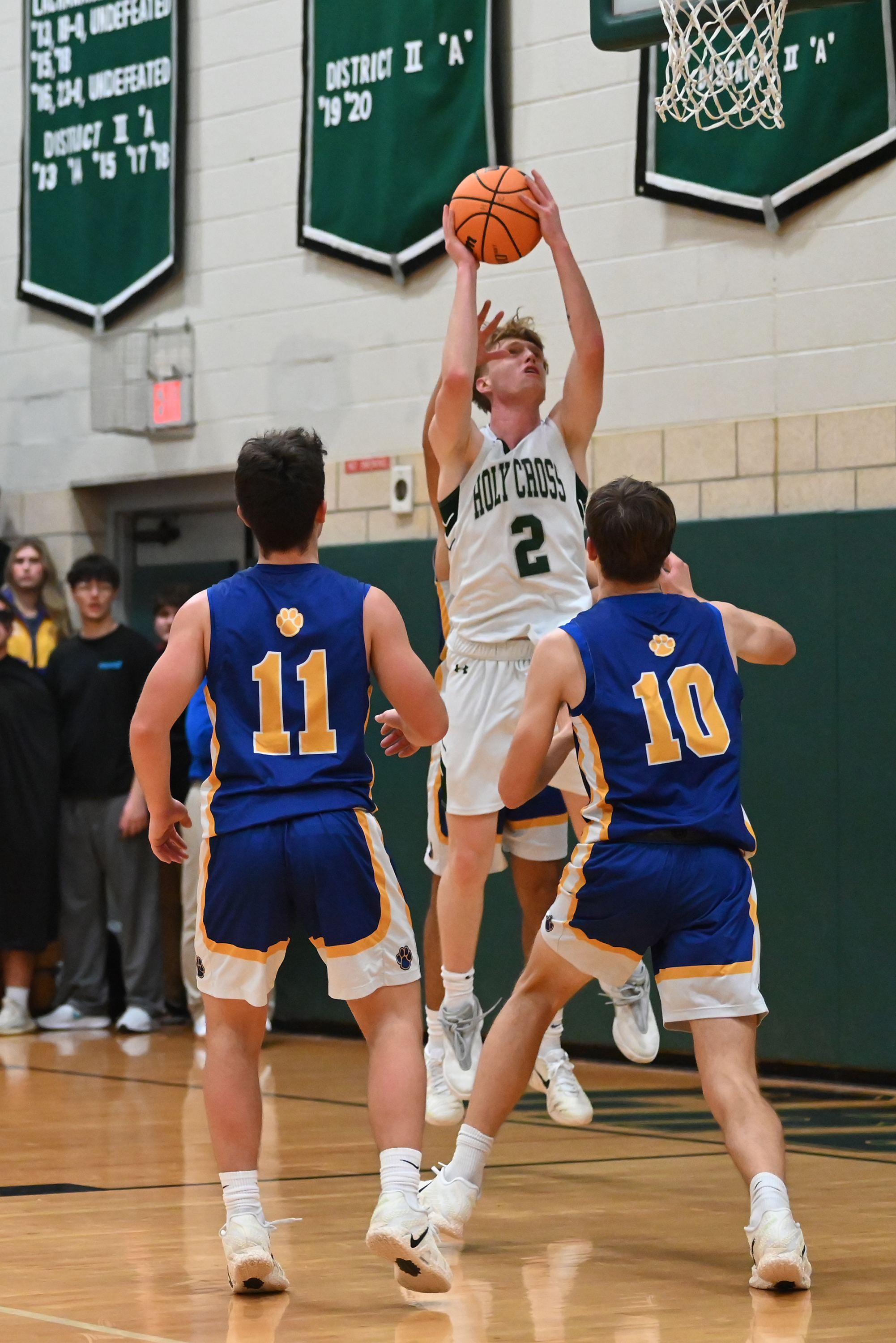 Holy Cross’ Adam Badyrka attempts a basket during the basketball...