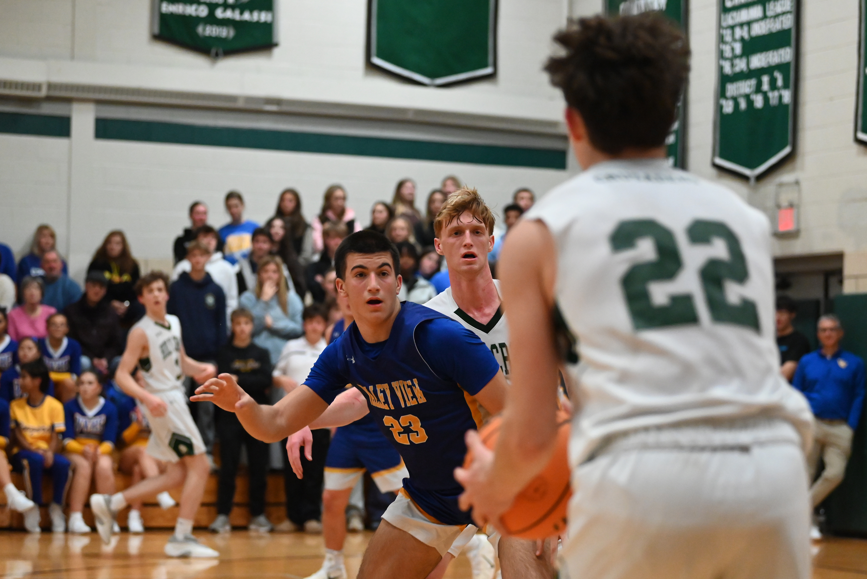 Holy Cross’ Jack Alpert looks for an open teammate to...