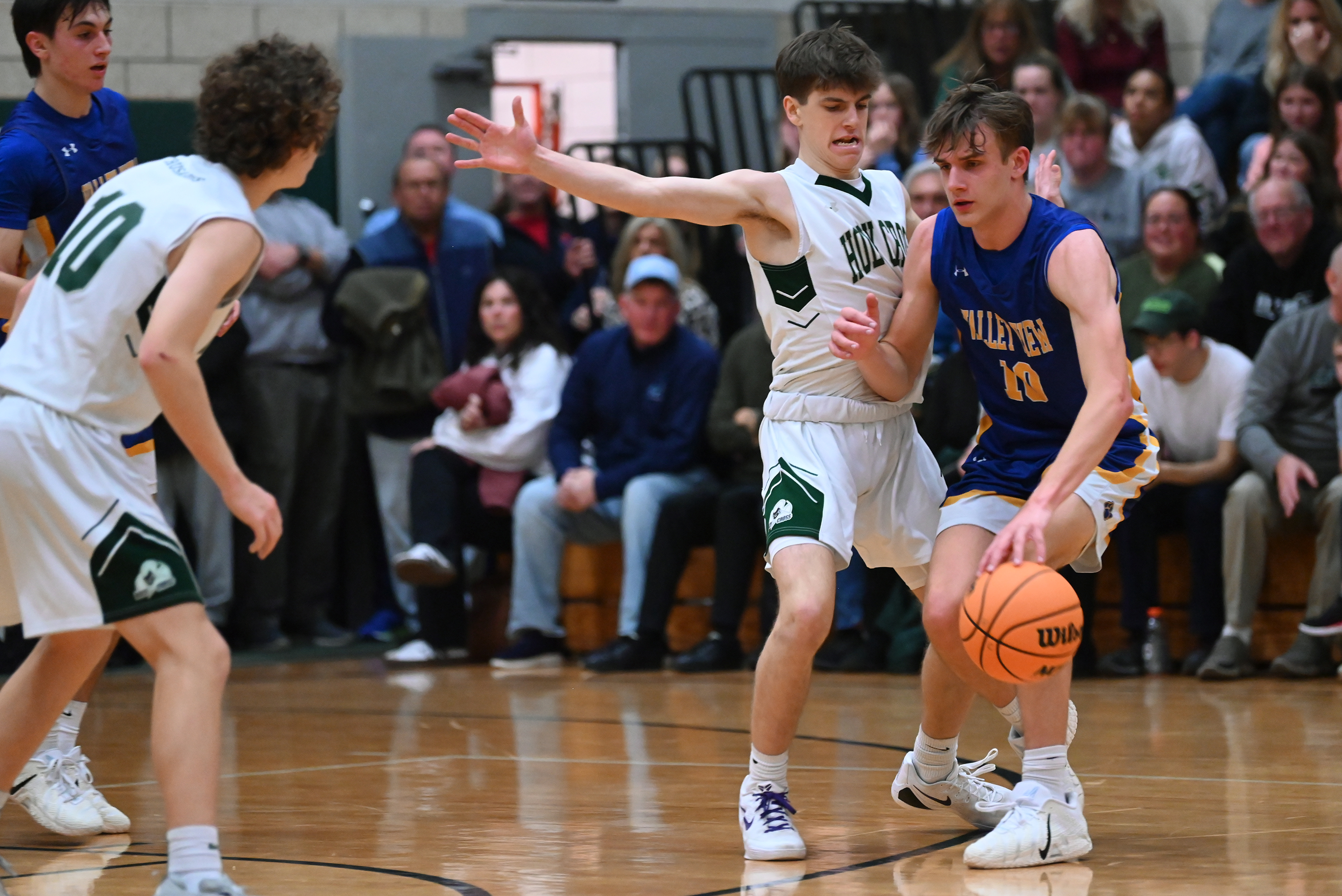Holy Cross’ Finn Kennedy attempts to stop Valley View’s Noah...