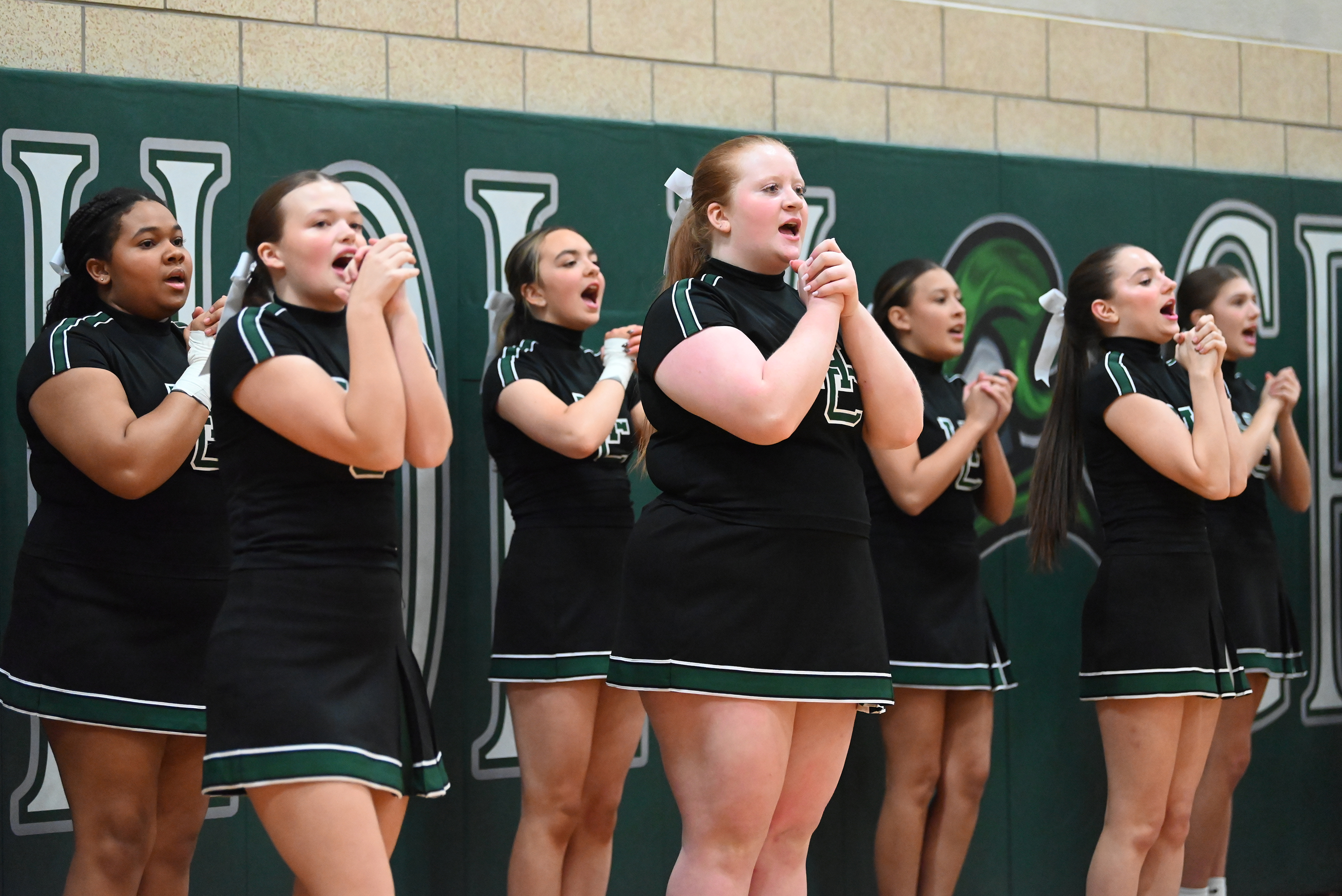 Holy Cross’ cheerleaders during the basketball game at Holy Cross...