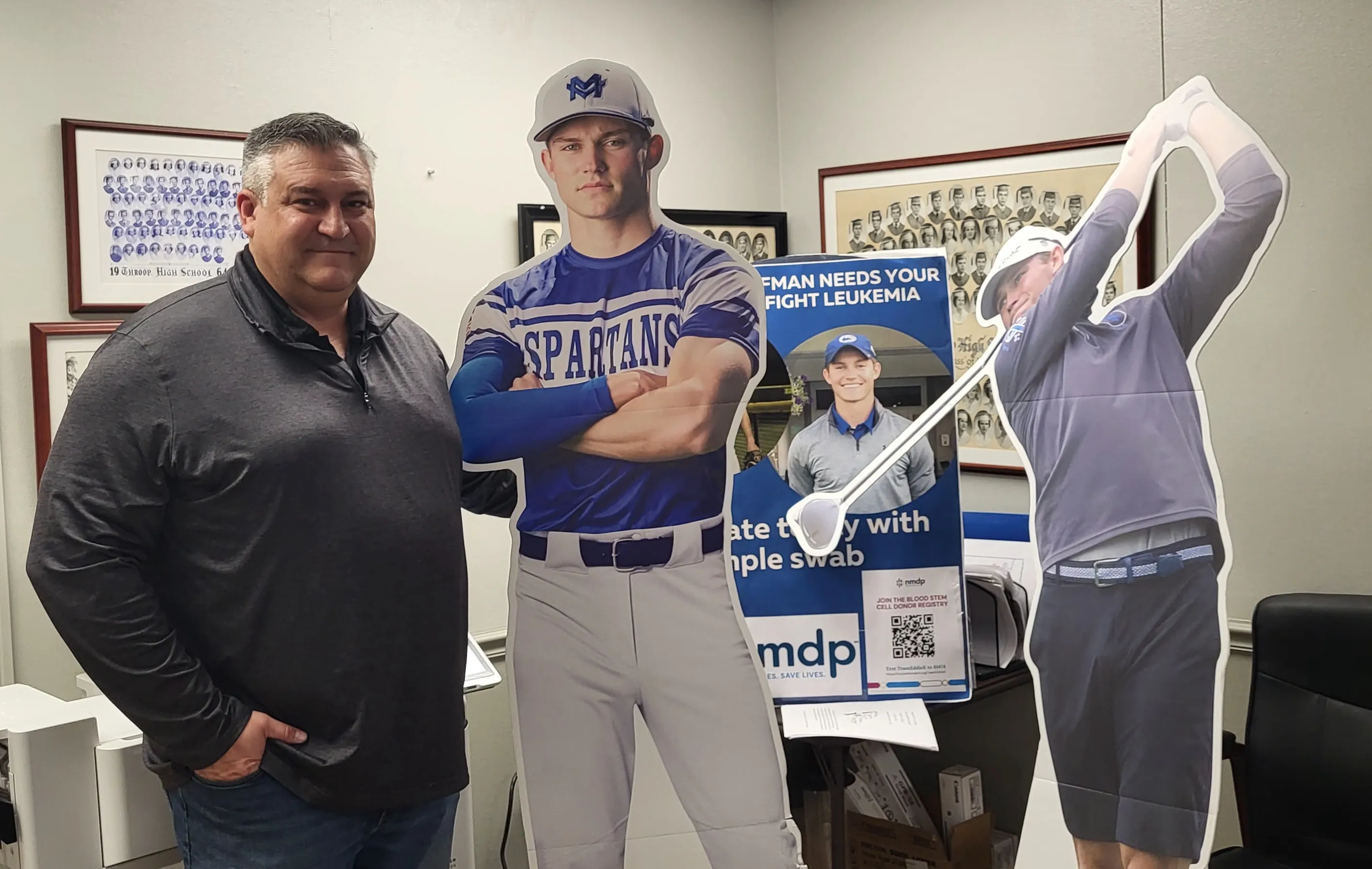 Brian Kaufman takes time for a photo with cutouts of...