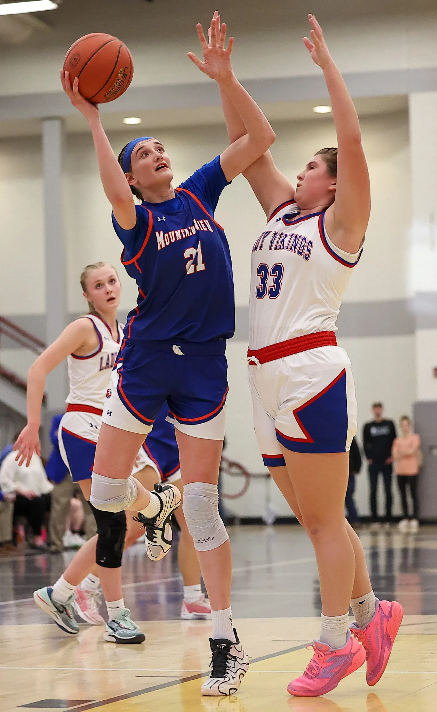 Mountain View’s Addison Kilmer (21) goes up for a shot...