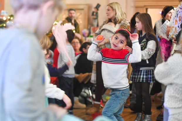 Dominic Baresse, 5, of Scranton, celebrates during the Noon Year's Eve: Countdown to 12:00 PM party at the Lackawanna County Children's Library in Scranton Wednesday, December 31, 2025. (SEAN MCKEAG / STAFF PHOTOGRAPHER)