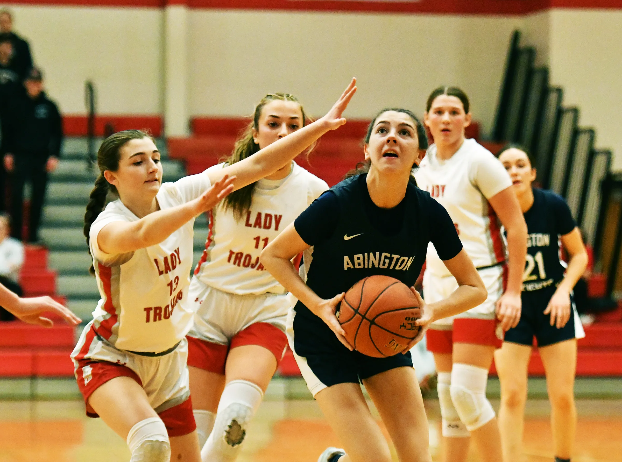 Abington Heights’ Emma Coleman avoids North Pocono’s Julia Biko and...