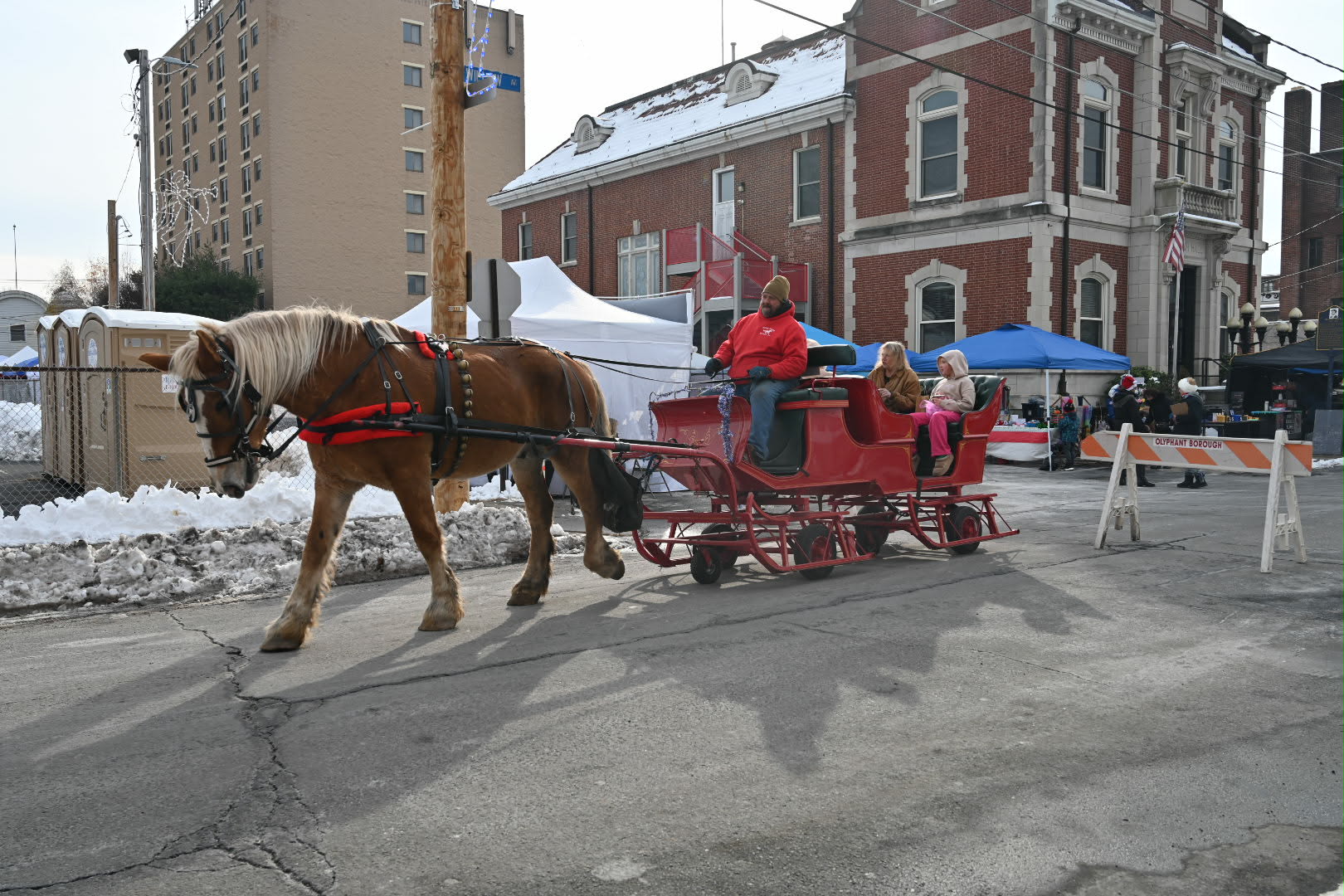 Horse-drawn carriage rides were offered at the Kris Kringle Market....