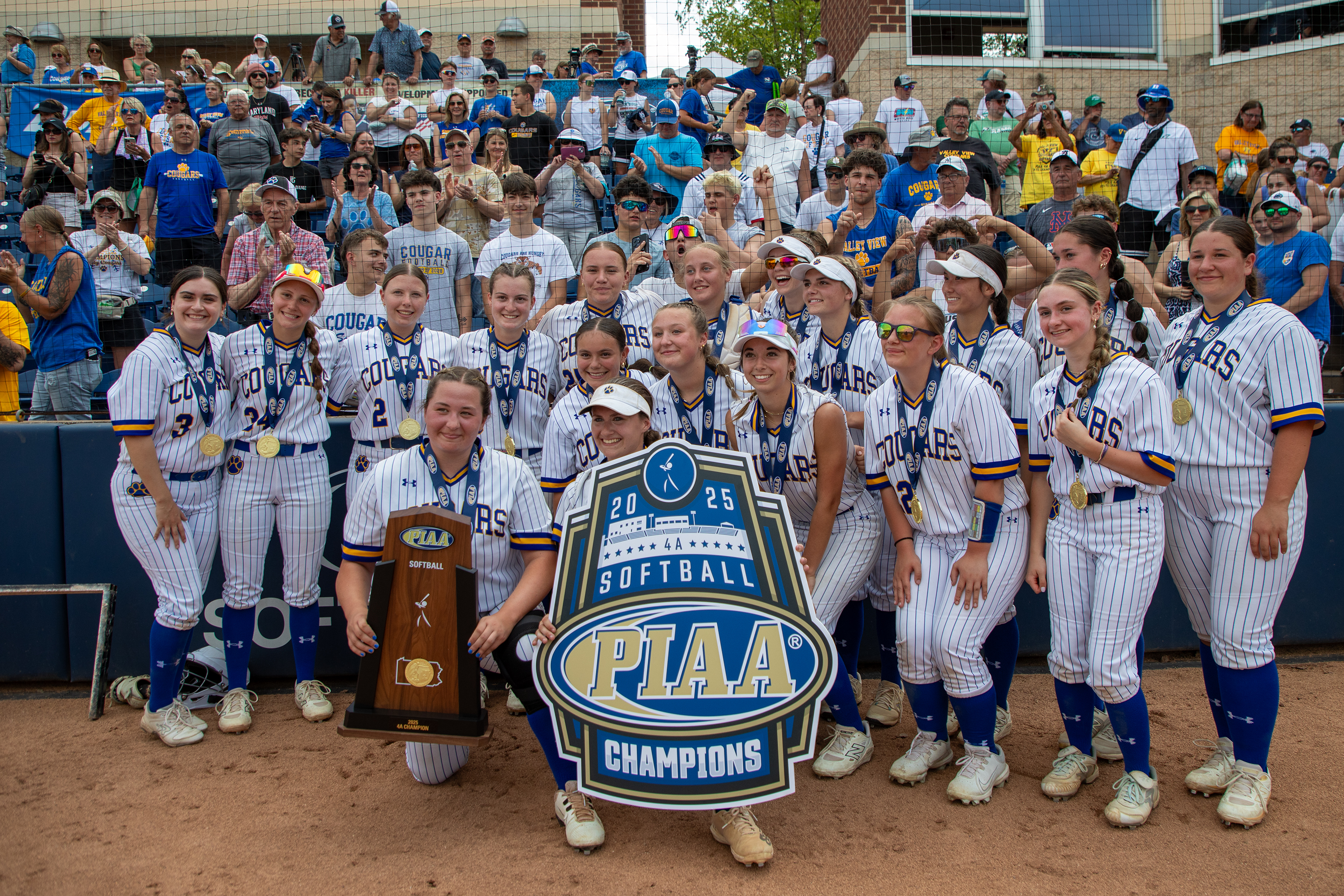 Valley View poses with their trophy and fans after winning...