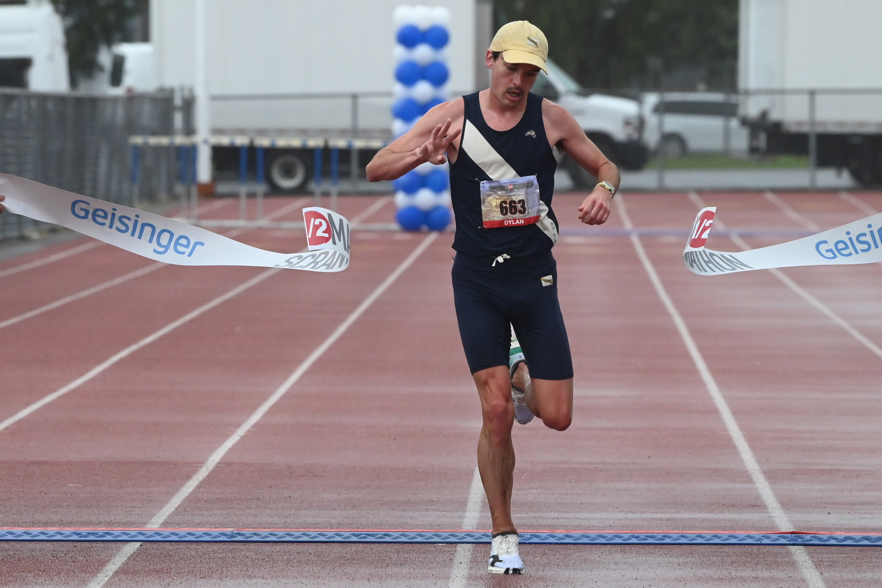 Dylan Gearinger of Philadelphia comes in first overall male, crossing...