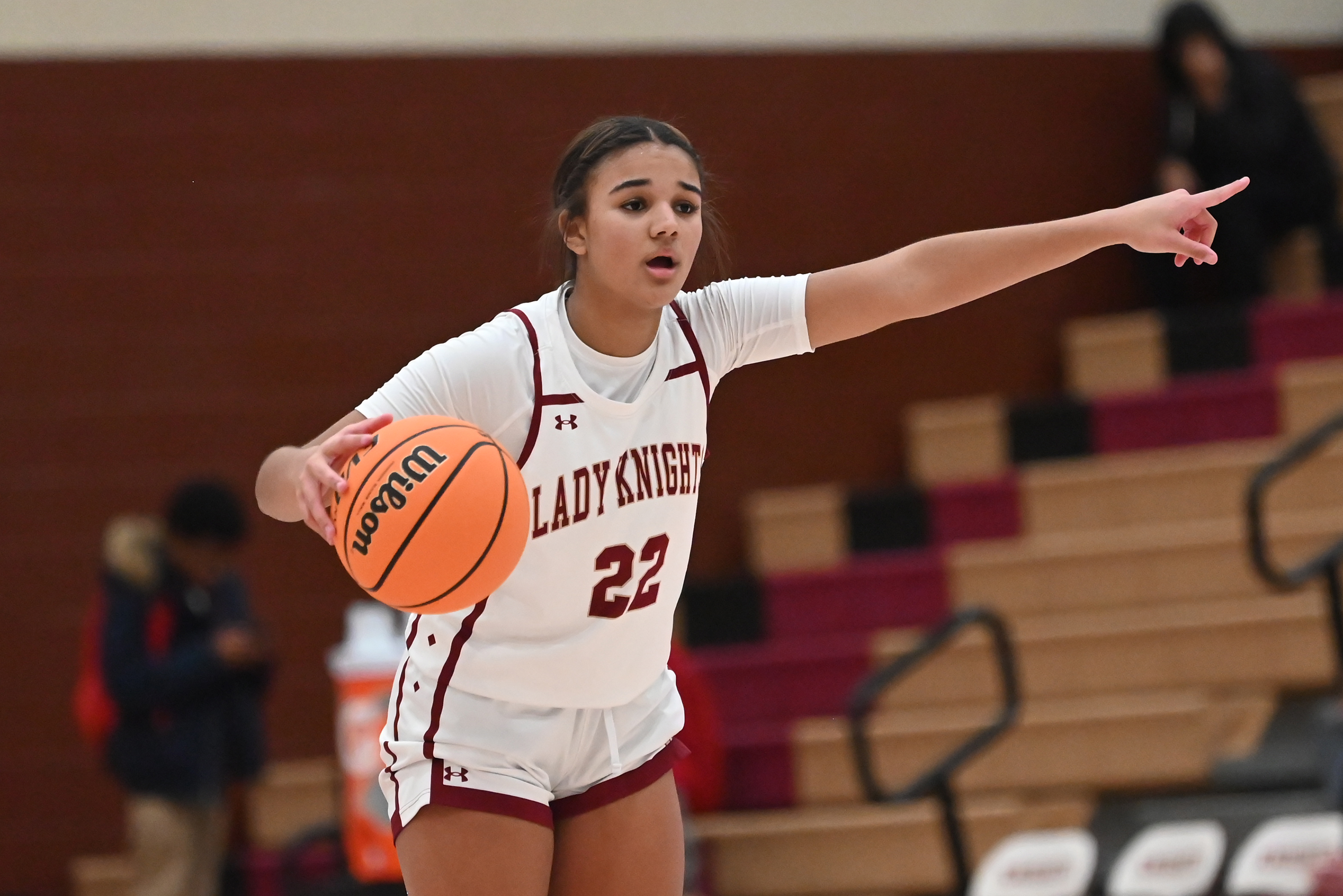 Scranton’s Jaelyn Alers directs her teammates during the basketball game...