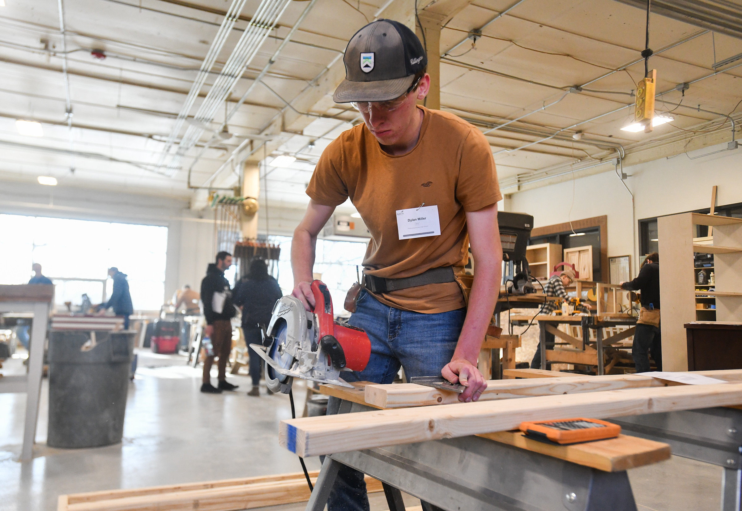 Wallenpaupack Area High School student Dylan Miller uses a circular...