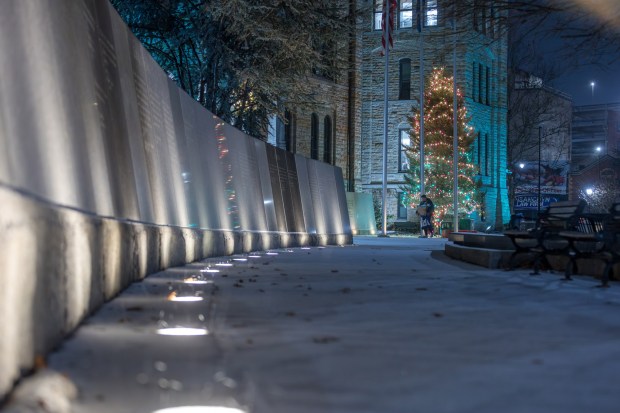 A man walks through frozen rain at Courthouse Square in Scranton on Friday, Dec. 26, 2025. (JASON ARDAN / STAFF PHOTOGRAPHER)