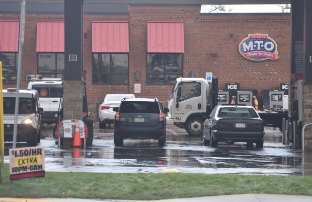 Commuters fill up their vehicles at the Sheetz in Scranton Friday, December 19, 2025. (SEAN MCKEAG / STAFF PHOTOGRAPHER)