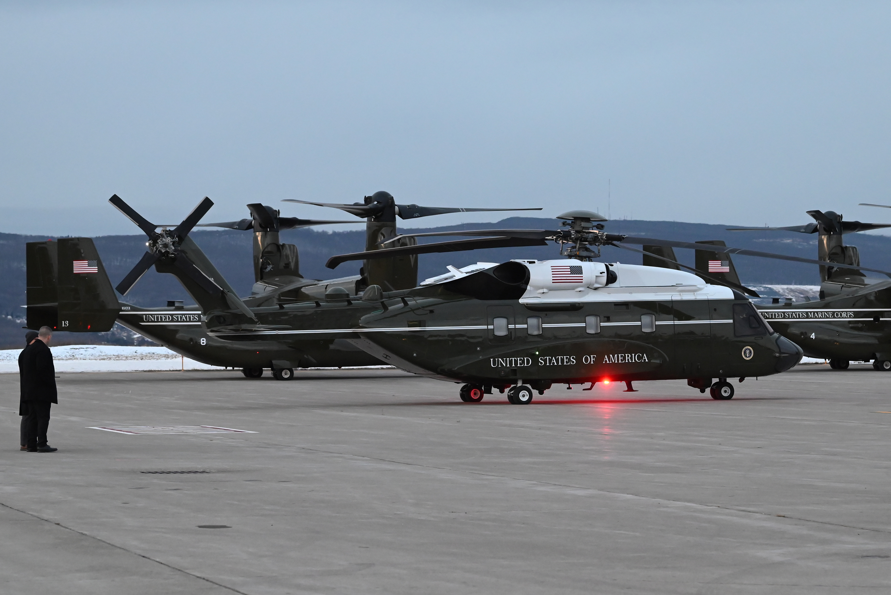 Marine Corps helicopters wait for Air Force One at the...