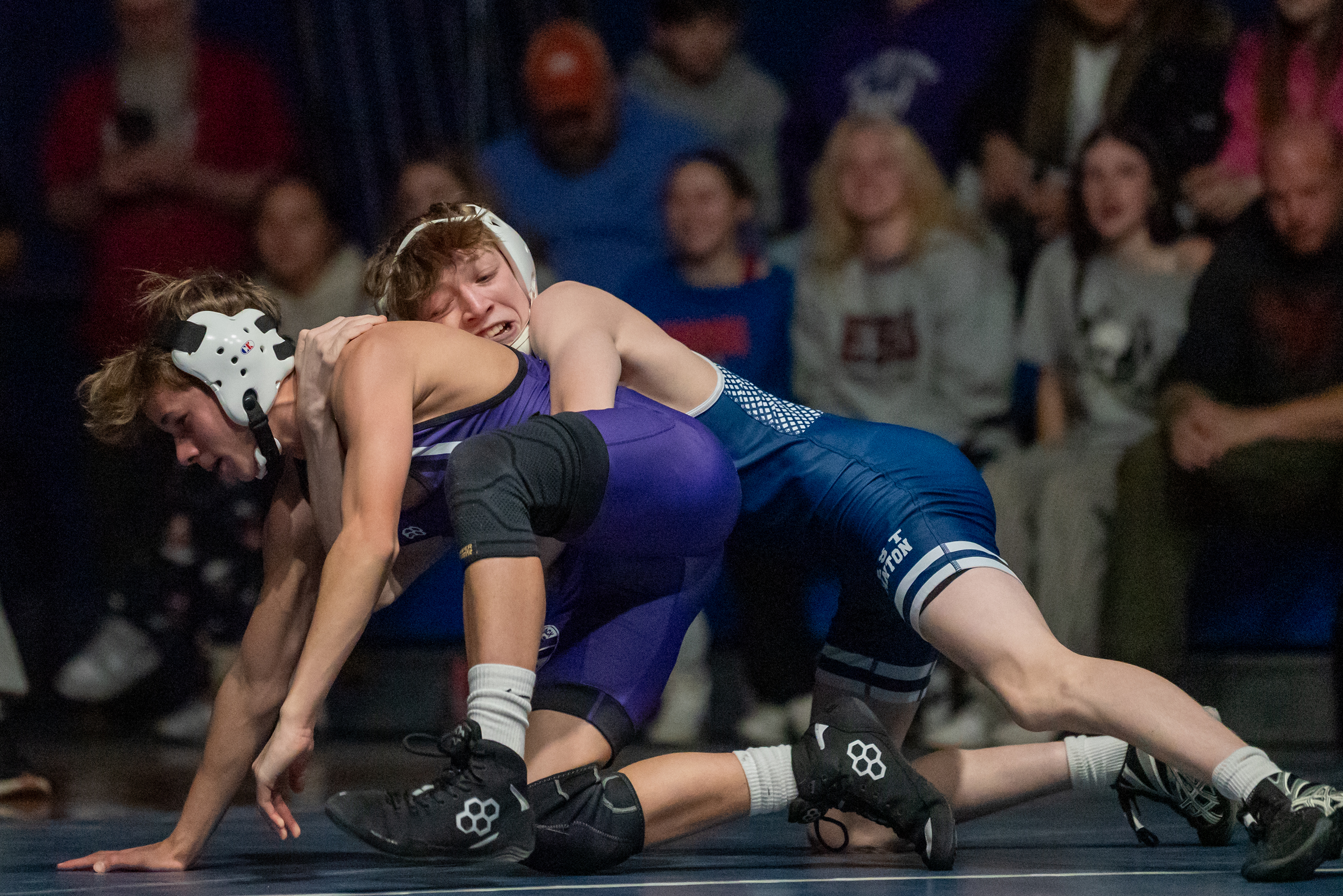 West Scranton’s Jullian Lagier, right, wrestles Wallenpaupack’s Dominick Tufaro during...