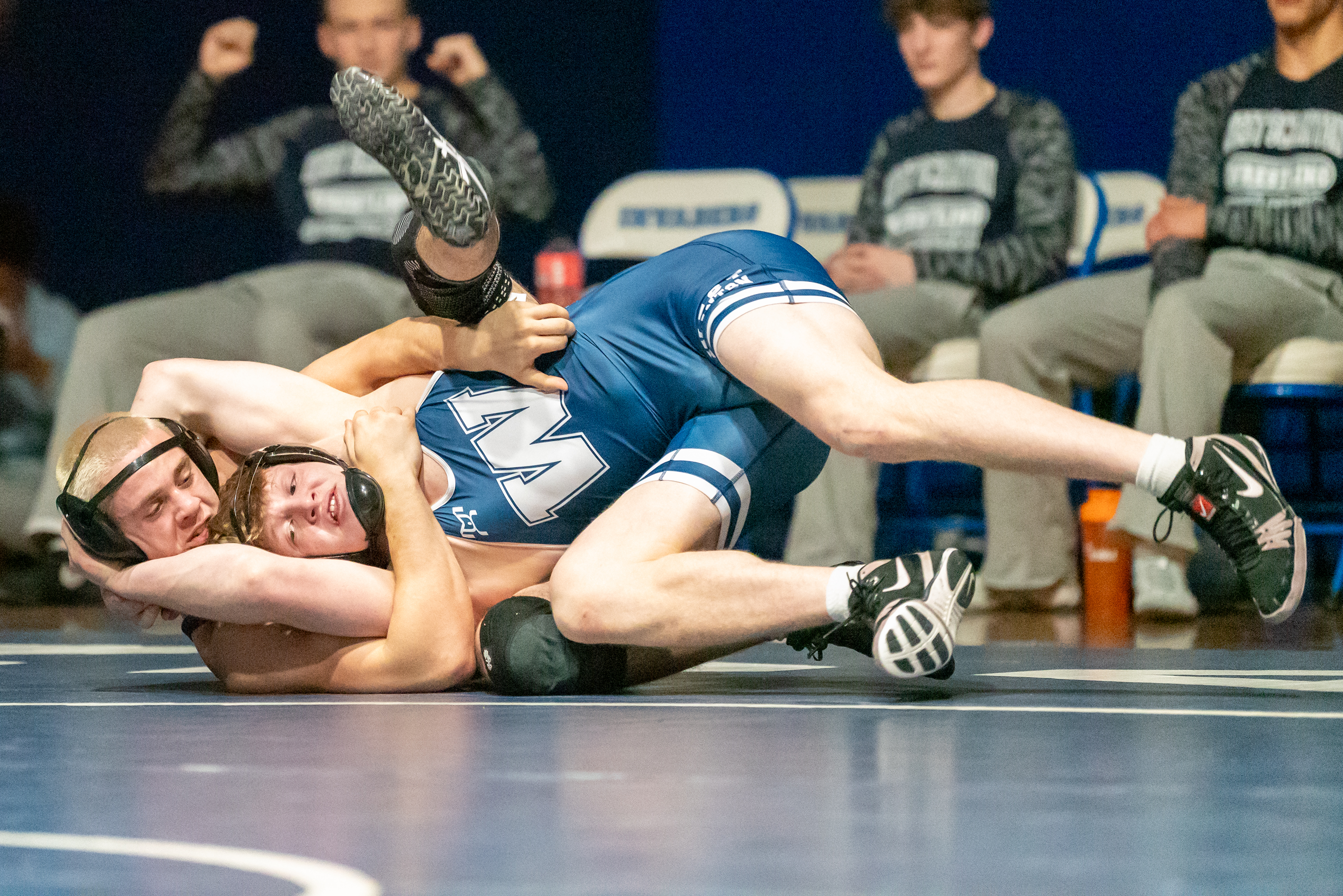 West Scranton’s Tommy Schechterly, front, wrestles Wallenpaupack’s Gabriel Caufield during...