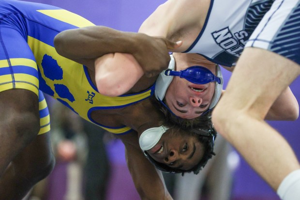 Valley View's Tywone Giles, left, and Abington Heights' Chace Berry wrestle Saturday during the Lackawanna League Championships at Wallenpaupack. (JASON ARDAN / STAFF PHOTOGRAPHER)