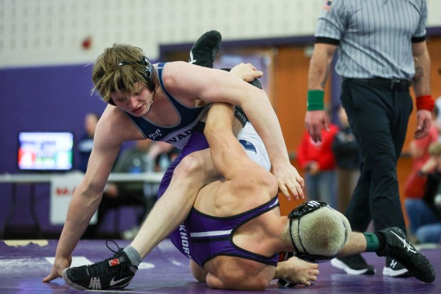 West Scranton's Tommy Schechterly, top, wrestles Wallenpaupack's Gabe Caufield during the Lackawanna League Championships on Saturday at Wallenpaupack. (JASON ARDAN / STAFF PHOTOGRAPHER)