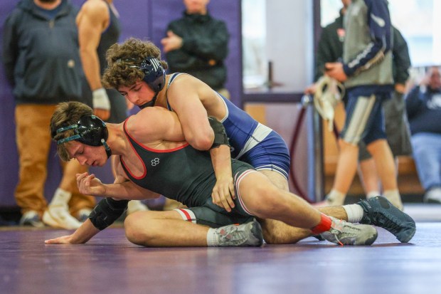 Abington Heights' Mason Whitney, right, wrestles Delaware Valley's Drew Churchill during the Lackawanna League Championships on Saturday at Wallenpaupack. (JASON ARDAN / STAFF PHOTOGRAPHER)