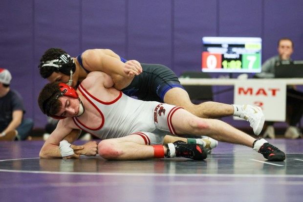 Mid Valley's Matthew Almedina, top, holds down Honesdale's Justin Scanlon during the Lackawanna League Championships on Saturday at Wallenpaupack. (JASON ARDAN / STAFF PHOTOGRAPHER)
