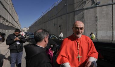 Latin Patriarch Pierbattista Pizzaballa, the top Catholic clergyman in the Holy Land, is received by local community while crossing an Israeli military checkpoint from Jerusalem ahead of celebrations at the Church of the Nativity, traditionally believed to be the birthplace of Jesus, on Christmas Eve, in the West Bank city of Bethlehem.
