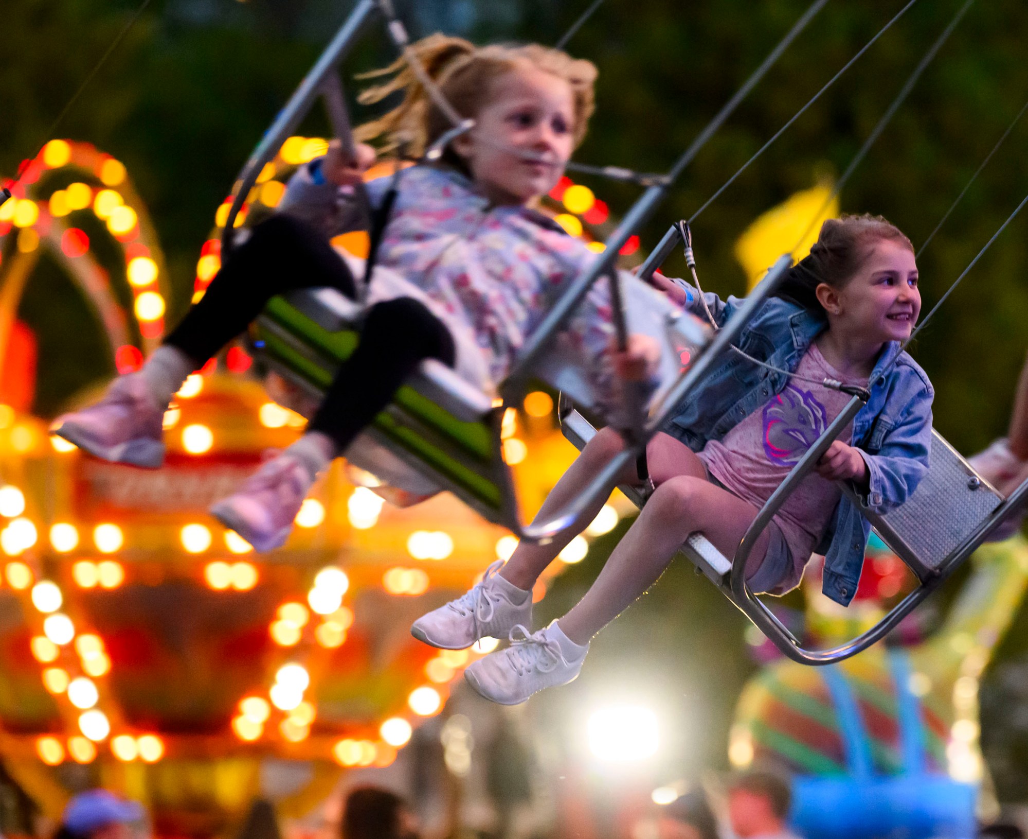 Abigail, 7, enjoys the ChairJet ride on Thursday, May 1, 2025, at the Bushkill Township Volunteer Fire Company Carnival. The carnival features rides, games, food, a silent auction/tricky tray, fire truck rides, live music, crafters, vendors, a beer tent and educational exhibits. It's open 6-11 p.m. Friday, 1-3 p.m. Saturday for special needs hours (sensory friendly) and then 3-11 p.m. general admission, and 1-6 p.m. Sunday. The event serves as a fundraiser for the volunteer fire company, which was established in 1959. (April Gamiz/The Morning Call)