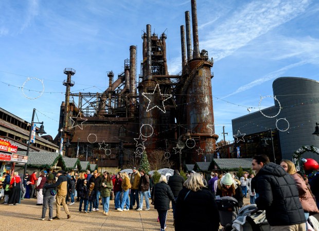 People enjoy the sights and sounds Saturday, Dec. 20, 2025, during Christkindlmarkt in Bethlehem. The German-inspired holiday market, which closes Sunday, Dec. 21, 2025, features artisan vendors, festive treats and family activities. (April Gamiz/The Morning Call)