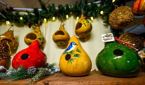 Hand-painted gourd bird houses are for sale at Everly Creations inside the Handwerk Haus on Saturday, Dec. 20, 2025, during Christkindlmarkt in Bethlehem. The German-inspired holiday market, which closes Sunday, Dec. 21, 2025, features artisan vendors, festive treats and family activities. (April Gamiz/The Morning Call)