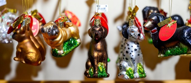 Käthe Wohlfahrt's glass ornaments seem to glow in the light Saturday, Dec. 20, 2025, during Christkindlmarkt in Bethlehem. The German-inspired holiday market, which closes Sunday, Dec. 21, 2025, features artisan vendors, festive treats and family activities. (April Gamiz/The Morning Call)