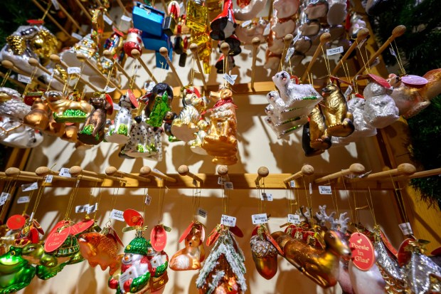Käthe Wohlfahrt's glass ornaments seem to glow in the light Saturday, Dec. 20, 2025, during Christkindlmarkt in Bethlehem. The German-inspired holiday market, which closes Sunday, Dec. 21, 2025, features artisan vendors, festive treats and family activities. (April Gamiz/The Morning Call)