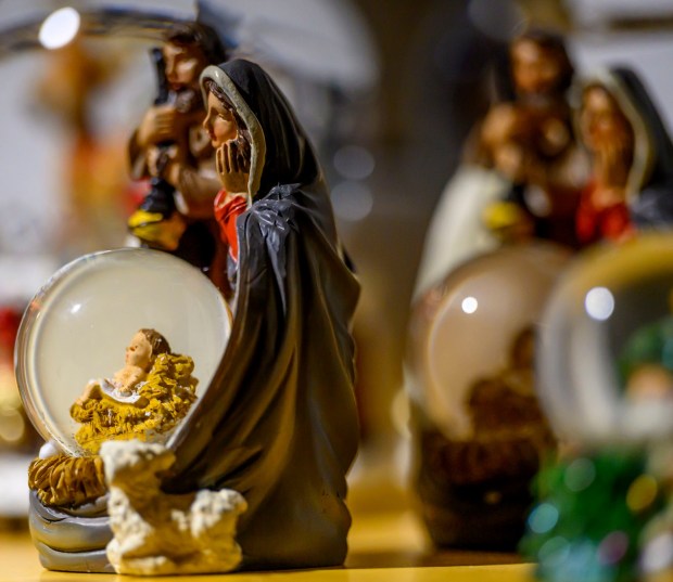 Käthe Wohlfahrt's glass ornaments seem to glow in the light Saturday, Dec. 20, 2025, during Christkindlmarkt in Bethlehem. The German-inspired holiday market, which closes Sunday, Dec. 21, 2025, features artisan vendors, festive treats and family activities. (April Gamiz/The Morning Call)