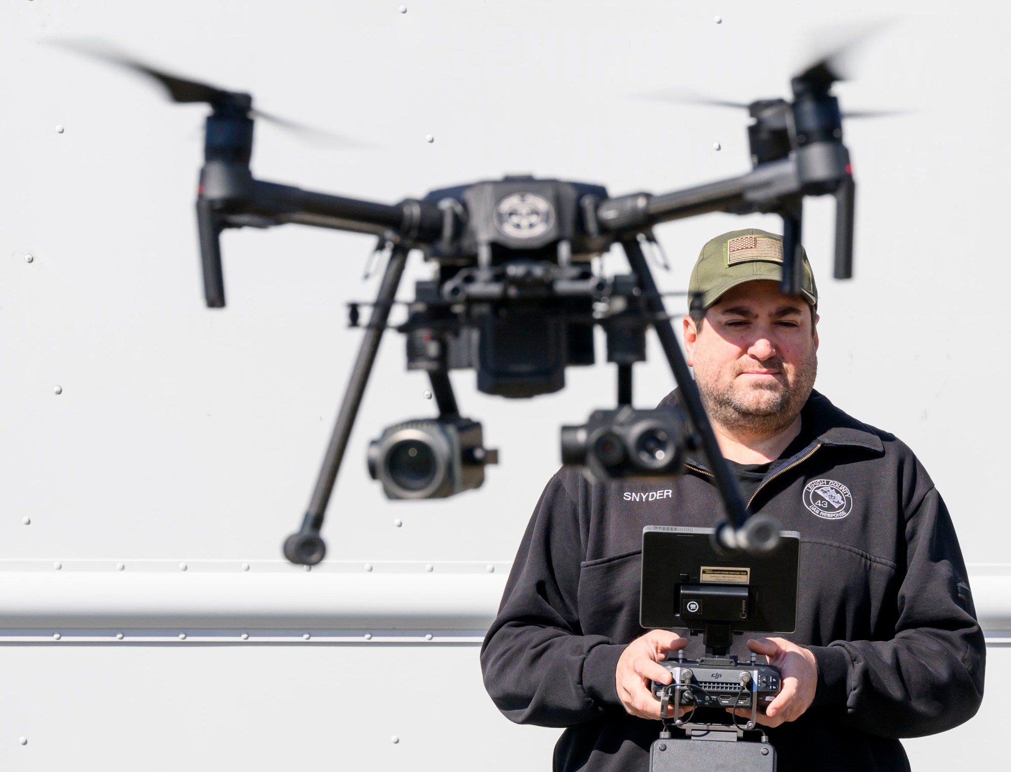 Steve Snyder, chief of the Lehigh County Drone Response Team, flies a DJI Matrice drone Friday, March 7, 2025, in South Whitehall Township. The drone includes a thermal camera.(April Gamiz/The Morning Call)