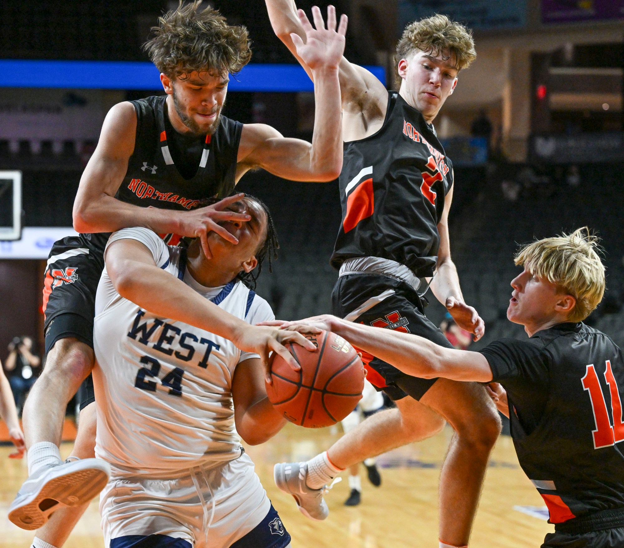 Pocono Mt. West's Adrian Brito is stopped by Northampton's Jake Raysely, Noah Walakovits, and Brady Simock on Thursday, Feb. 13, 2025, during the EPC boys championship basketball game at PPL Center in Allentown. (April Gamiz/The Morning Call)