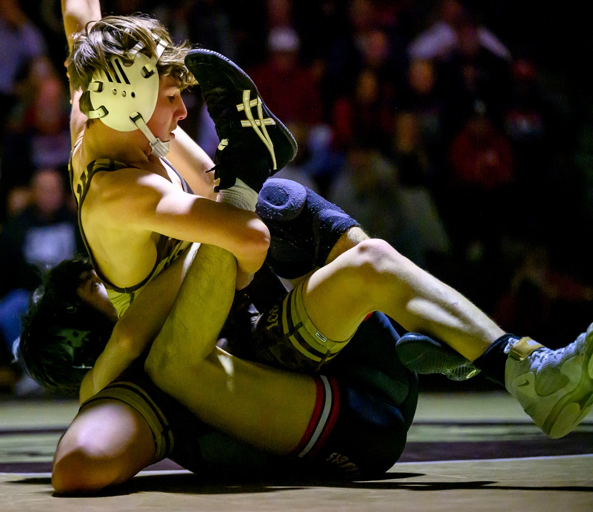 Bethlehem Catholic's Gino Bozzi wrestles Easton's Brayden Abrams in the 114-pound weight class Wednesday, Dec.17, 2025, in Bethlehem. (April Gamiz/The Morning Call)