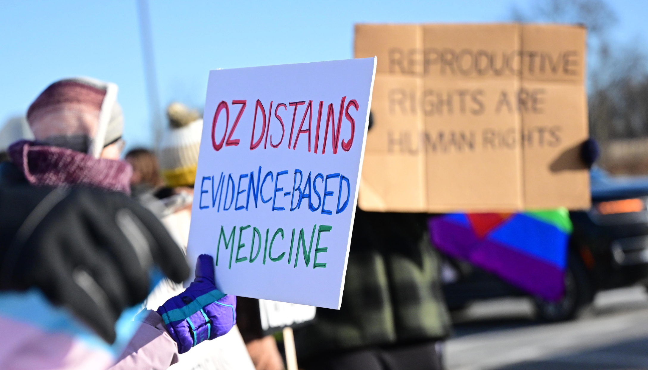 Protesters rally outside after Dr. Mehmet Oz, administrator for the...
