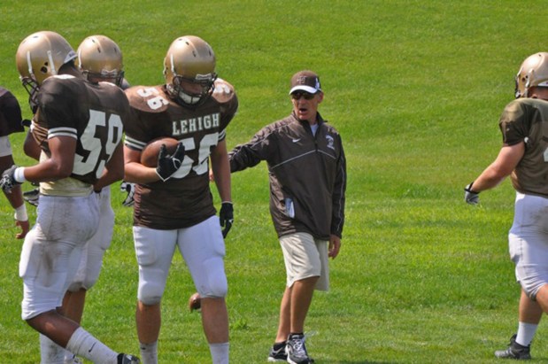 Joe Bottiglieri, seen working with Lehigh football players during his time as the Mountain Hawks' defensive coordinator, has retired after 53 seasons as a football coach. He most recently was the defensive coordinator at Liberty. (Lehigh University/contributed photo)