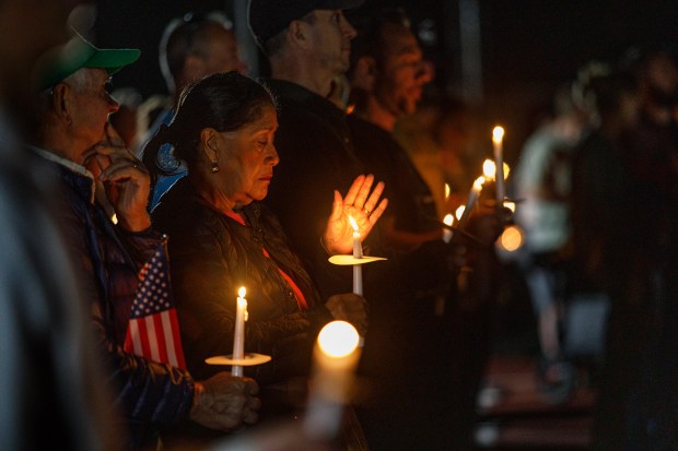 People attend a candelight vigil in memory of slain conservative political activist Charlie Kirk on Sunday, Sept. 21, 2025, at Water Street Park in Hellertown. (Jane Therese/Special to The Morning Call)