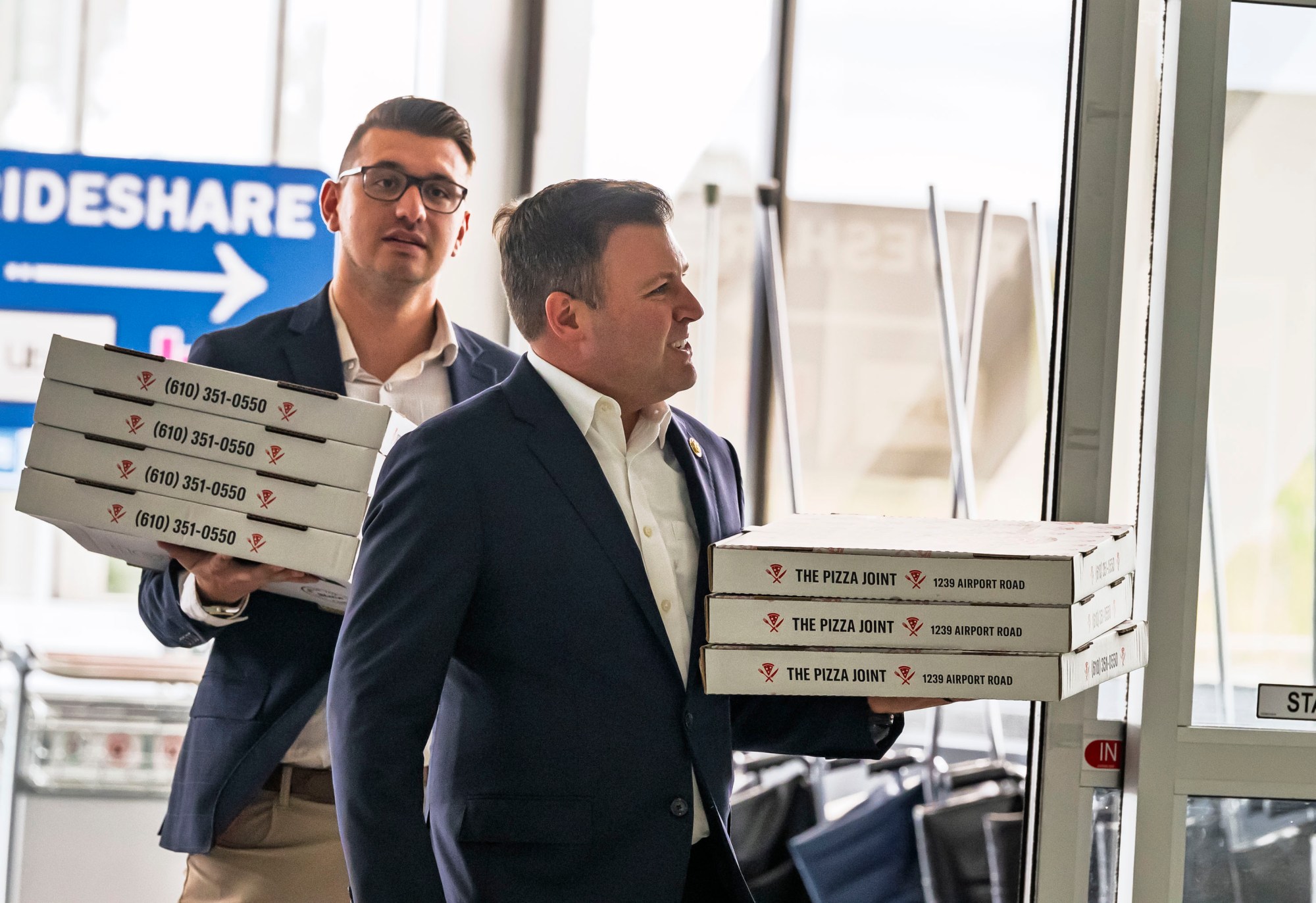 U.S. Rep. Ryan Mackenzie, R-7th District, delivers pizzas to workers Tuesday, Oct. 14, 2025, at Lehigh Valley International Airport in Hanover Township, Lehigh County. Mackenzie visited the airport to thank local federal workers and discuss the ongoing federal government shutdown. (April Gamiz/The Morning Call)