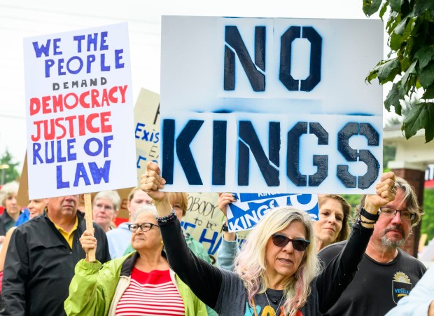 People march toward downtown Bethlehem during a "No Kings" protest Saturday, June 14, 2025, at the Rose Garden in Bethlehem. The rally, one of several in the Lehigh Valley, was part of the nationwide "No Kings" demonstrations coinciding with President Donald Trump's military parade in Washington. (April Gamiz/The Morning Call)