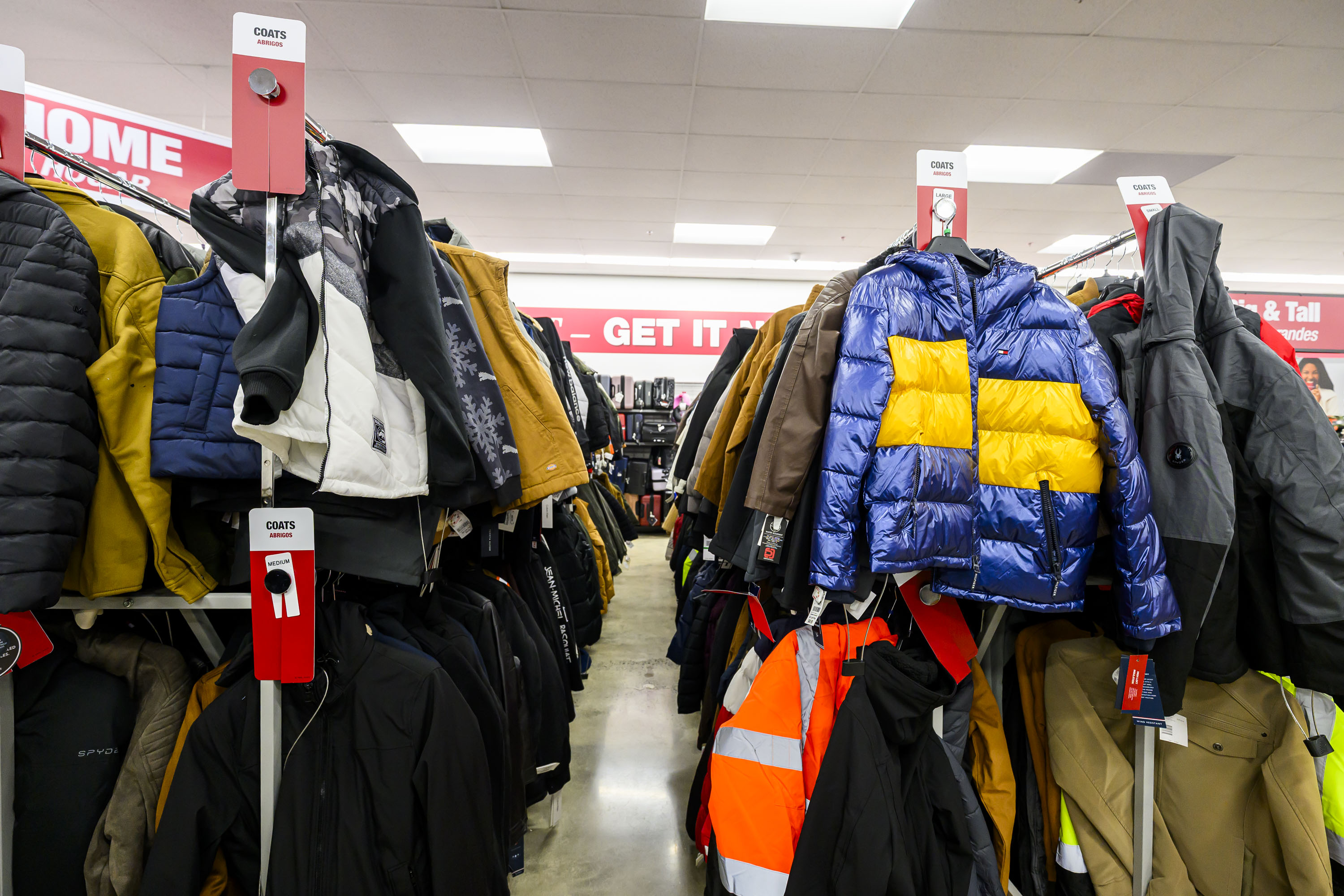 Coats line aisles Tuesday, Dec. 9, 2025, at the newly...