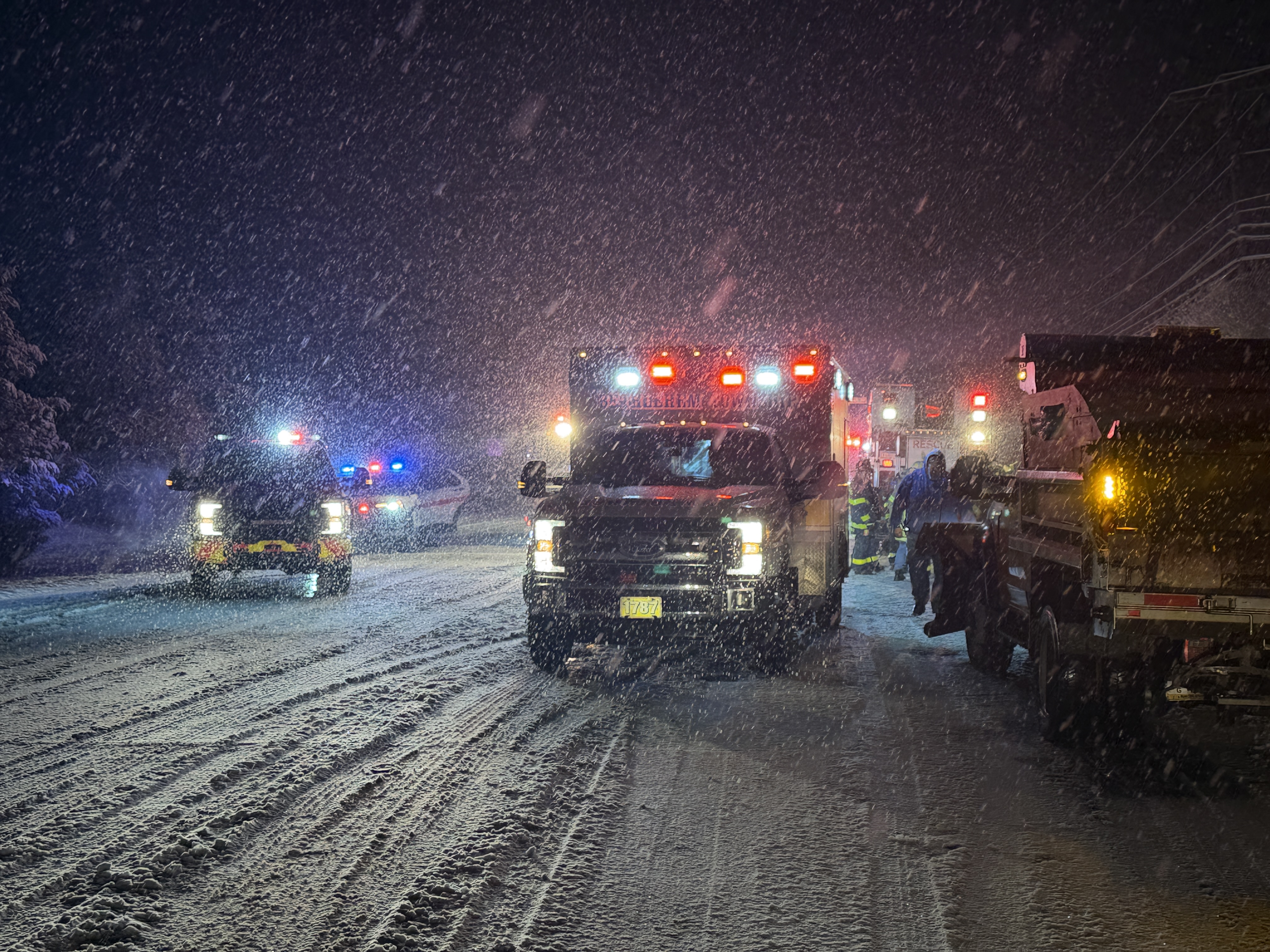 Emergency crews tend to a vehicle rollover in East Allen Township as a winter storm drops 2-4 inches of snow across the Lehigh Valley on Saturday night into Sunday morning Dec. 14, 2025, with cold temperatures and slick roads. (Rich Rolen/Special to The Morning Call)