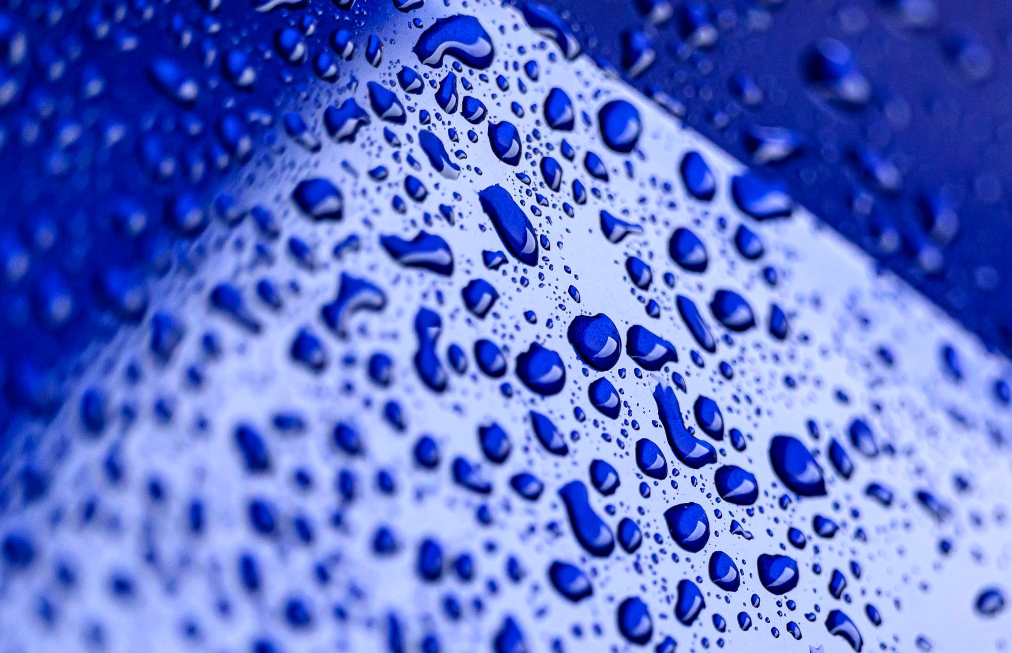 Rain drops form on the hood of a car Friday, May 16, 2025, in Bethlehem. A line of severe storms moving across eastern Pennsylvania prompted the National Weather Service to issue a severe thunderstorm warning for the Lehigh Valley and surrounding region Friday morning. There is a possibility of more storms Saturday. (April Gamiz/The Morning Call)