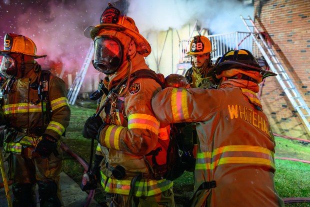 Firefighters respond to a fire Saturday evening Dec. 13, 2025, at the Fairmont Place Apartments on Maryland Circle in Whitehall Township. (Scott M. Nagy/Special to The Morning Call)