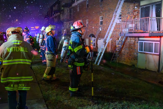 Firefighters respond to a fire Saturday evening Dec. 13, 2025, at the Fairmont Place Apartments on Maryland Circle in Whitehall Township. (Scott M. Nagy/Special to The Morning Call)