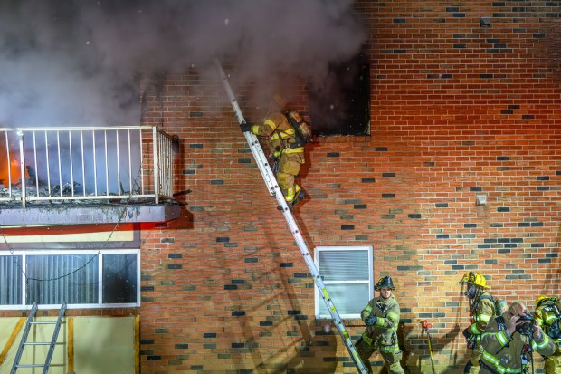 Firefighters respond to a fire Saturday evening Dec. 13, 2025, at the Fairmont Place Apartments on Maryland Circle in Whitehall Township. (Scott M. Nagy/Special to The Morning Call)